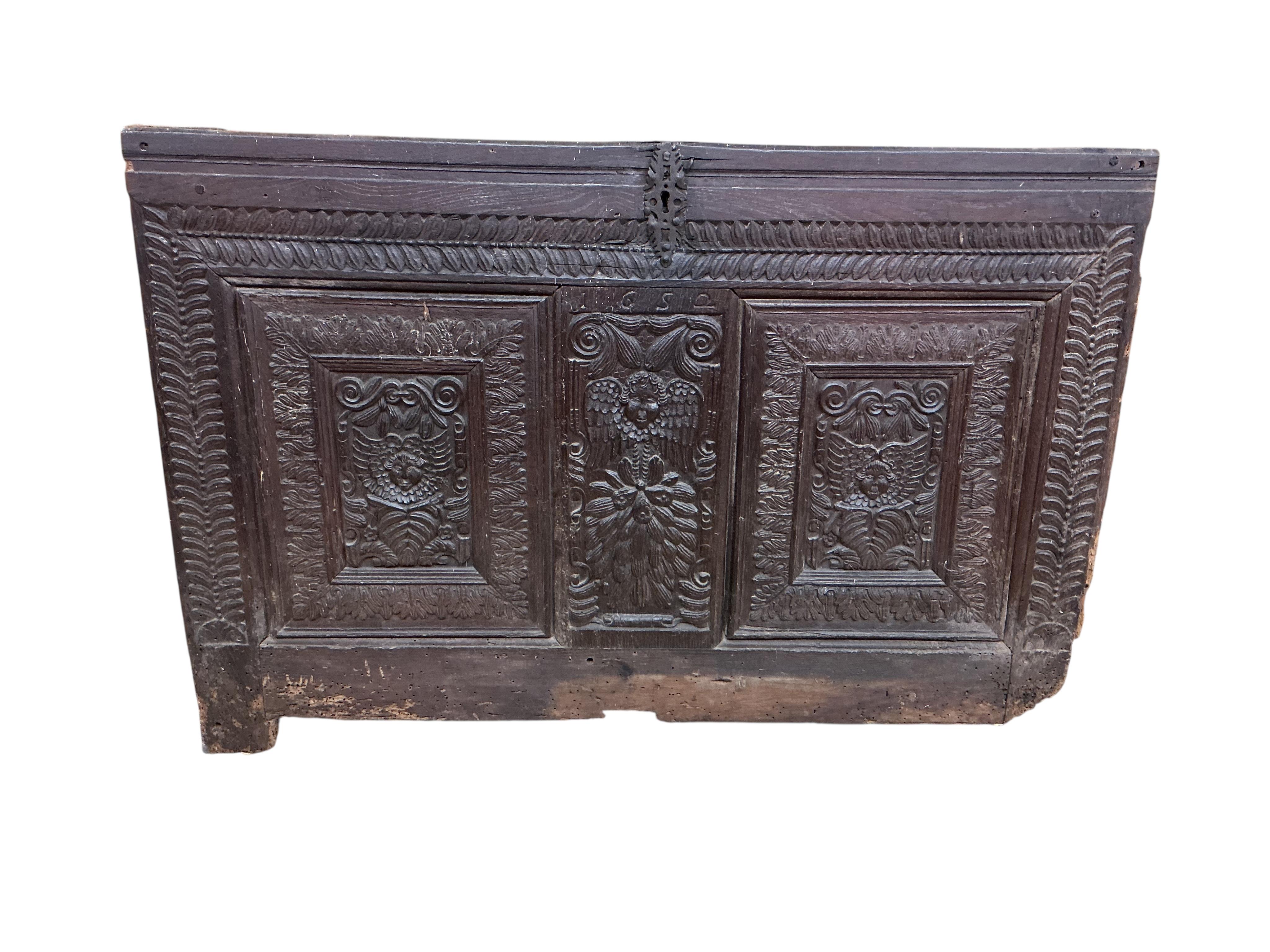 A 17th century carved oak panel, width 126cm, height 86cm